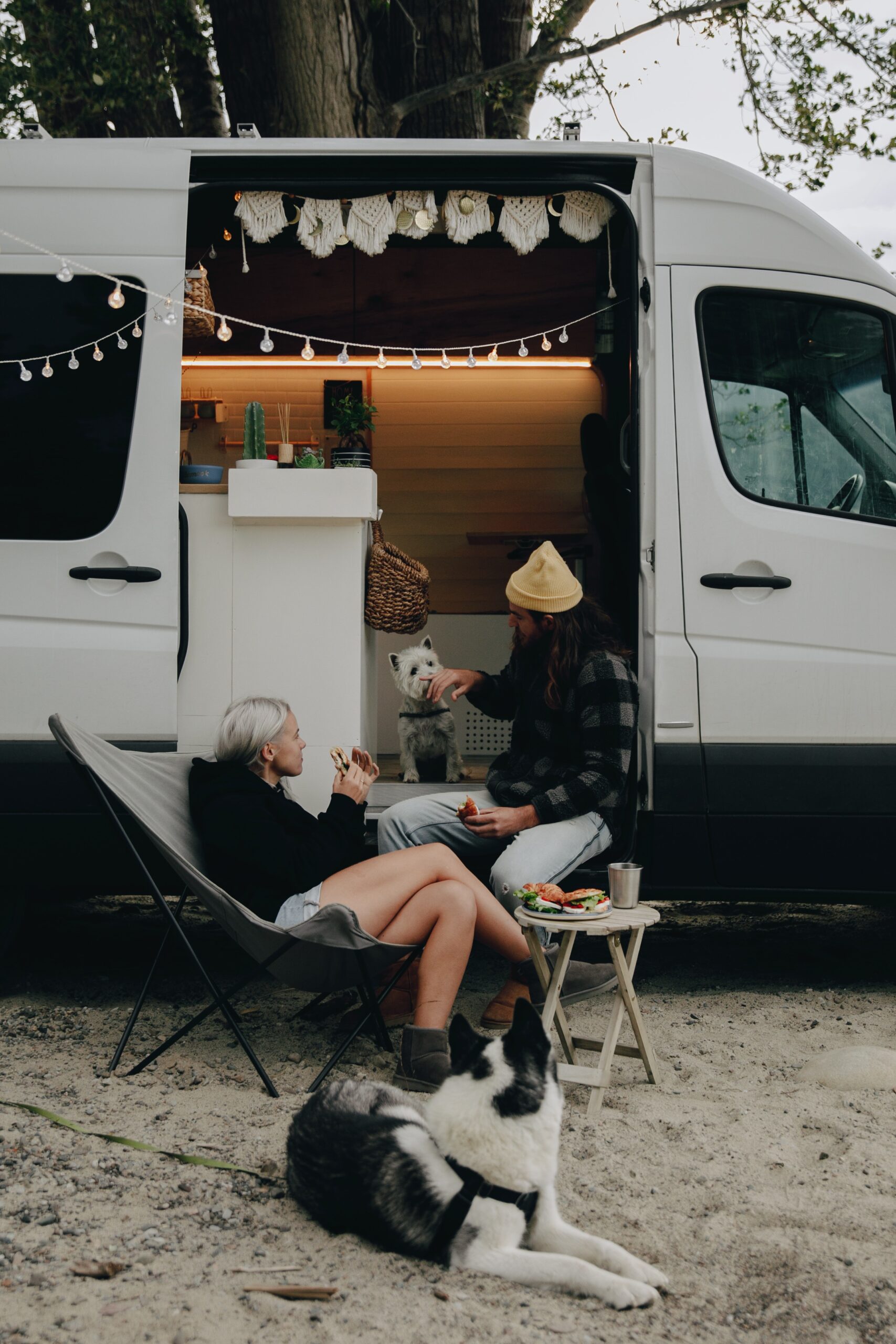 people gathering around an rv about to watch tv on an antenna watching tv on the best rv antenna