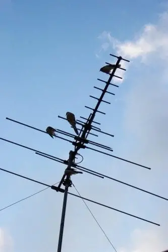 a big tv antenna with sky background
