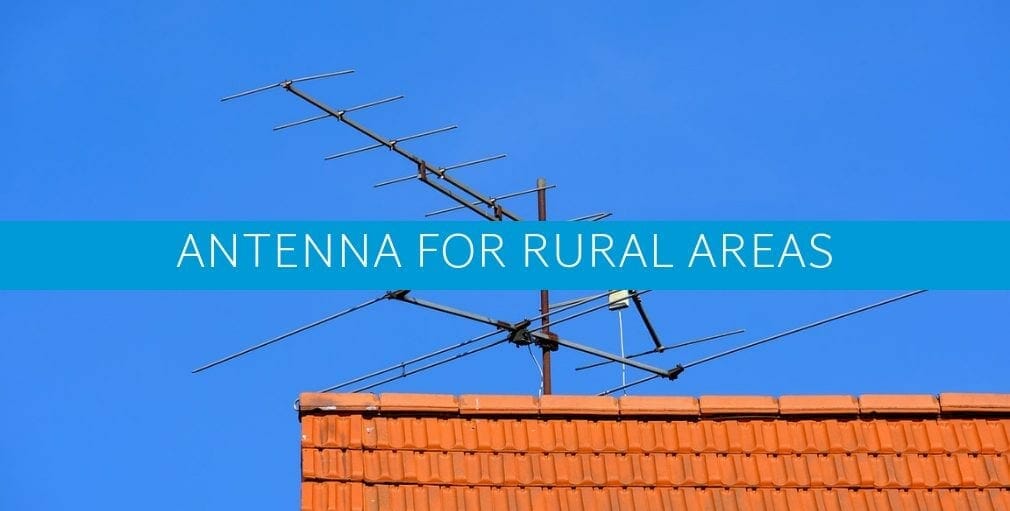 a tv antenna outdoor on a building in a rural area