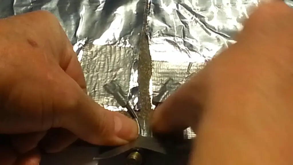 attaching the transformer to the aluminum foil sheet