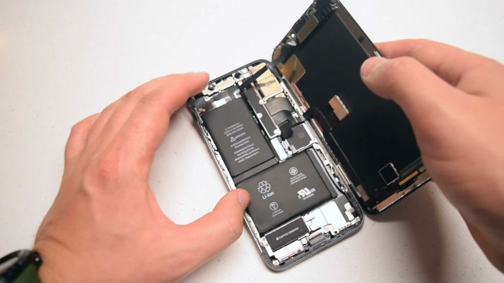 man opening his iphone 11 device