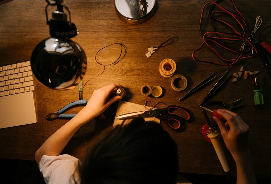 woman working on electrical tools