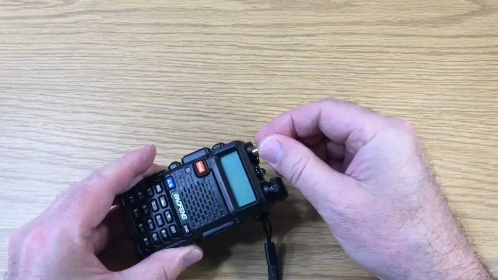 man setting up a radio receiver