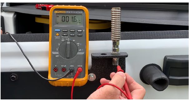 multimeter at a reading of 001.6v